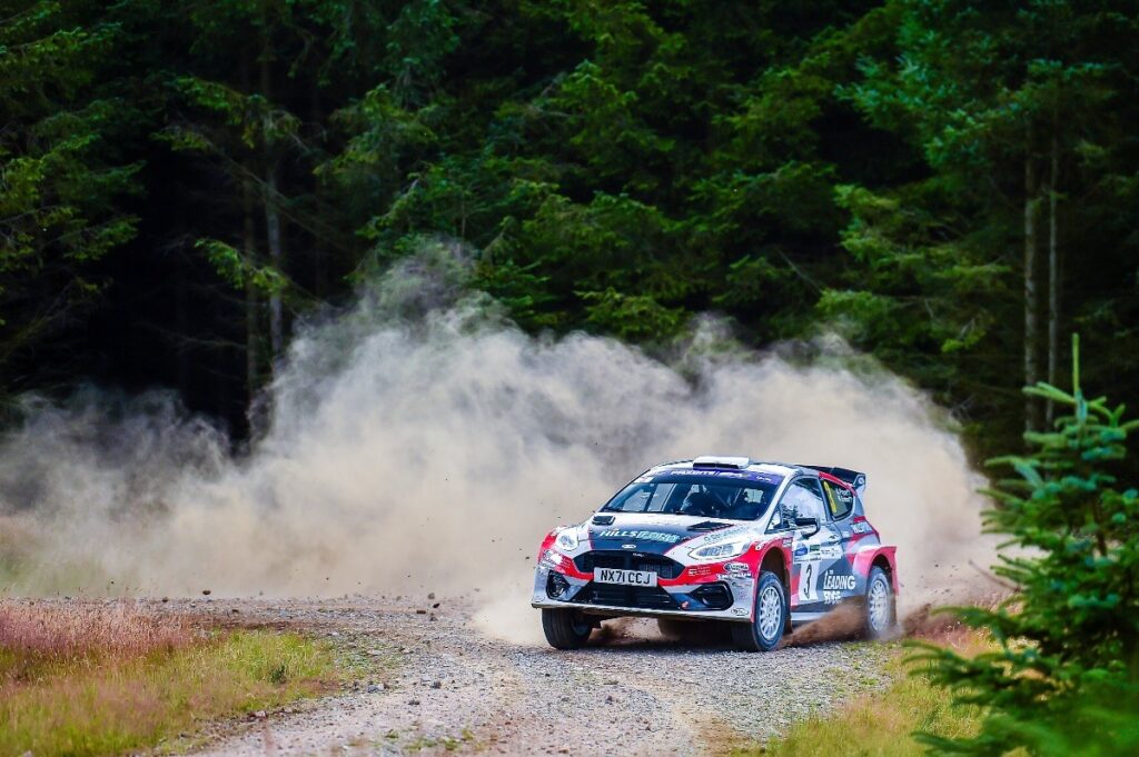 Fiesta flicking up dust on a stage.